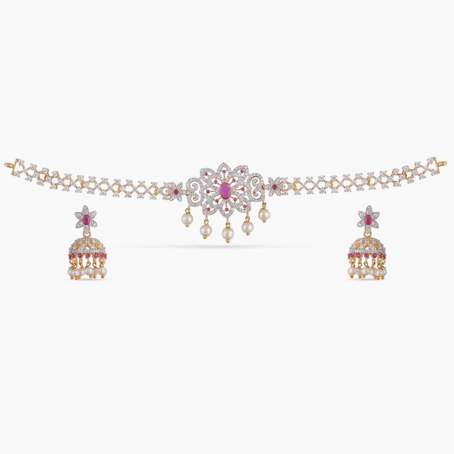 A picture of an Indian artificial jewelry set with a gold plated choker necklace and matching earrings adorned with Cubic Zirconia and red gemstones.